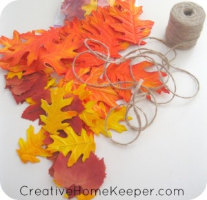 Add a little warmth and a touch of fall to your home with this simple DIY twine and leaf garland. Only a few supplies needed, this makes for an easy and frugal family friendly fall craft. | CreativeHomeKeeper.com